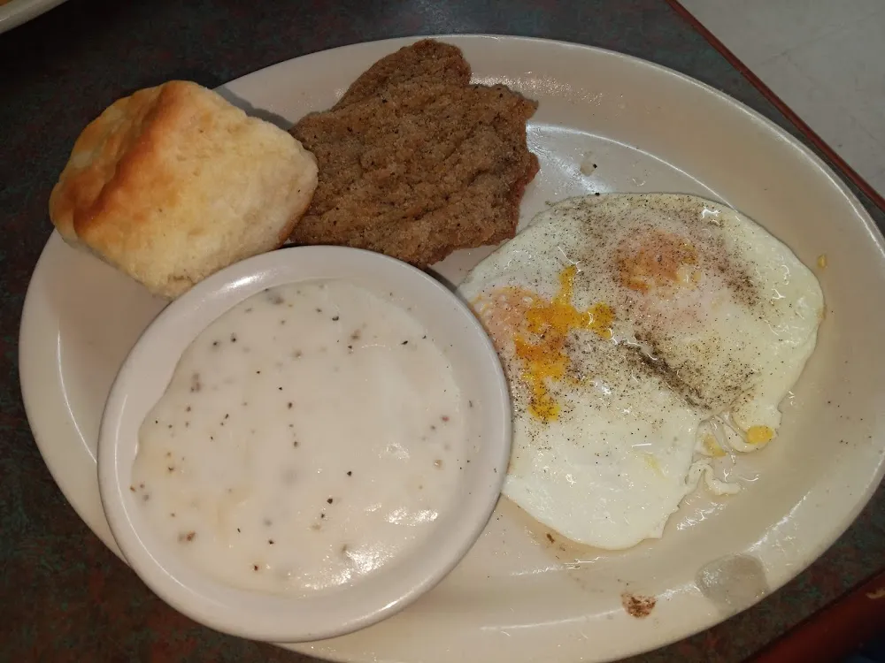 Country Fried Steak Two Eggs over Medium Biscuits and Gravy